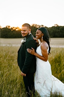 Jasmyn + David Arechiga outside during bridal portraits at Emerson Venue in Dallas Fort Worth Texas with photographer D Ring Creative