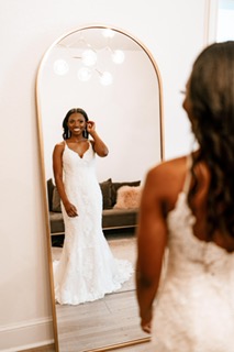 Jasmyn Poe Arechiga in the bridal suite at Emerson Venue in Dallas Fort Worth Texas in a Lace Wedding Dress by Maggie Sottero from Ava's Bridal Couture ready to walk down the isle.