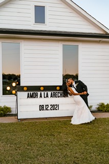 Jasmyn + David Arechiga kissing on their wedding day at Emerson Venue in Dallas Fort Worth Texas