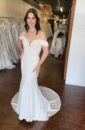 Off the Shoulder Fitted Minimal Wedding Dress with V Neckline and Detailed Lace Illusion Back