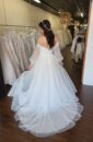 Off the shoulder Clean Flowy Wedding Dress with sleeves and a Slit